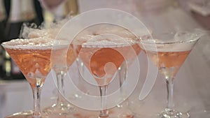 Goblets with seething rose wine
