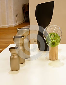 Goblets and vases displayed on a white table