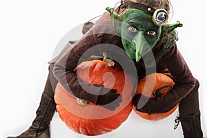 Goblin with pumpkins, halloween costume