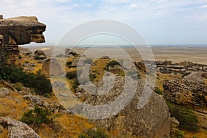 Gobustan national park ancient rocks, rock path and mountains near Baku in Azerbaijan. Exposition of Petroglyphs in Gobustan near