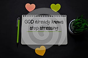 God Already Knows Stop Stressing write on a book  on office desk. Christian faith concept