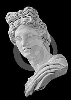 God Apollo bust sculpture. Ancient Greek god of Sun and Poetry Plaster copy of a marble statue isolated on black