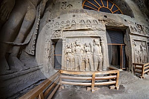 God budha hand-made scriptures on walls in historic and centuries old kanheri caves in mumbai, India