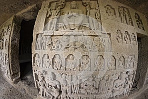 God budha hand-made scriptures on walls in historic and centuries old kanheri caves in mumbai, India