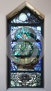 God leads his own to completion in all his glory, detail of stained glass window in church of Saint John in Piflas, Germany