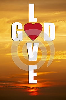 God is love. crossed words forming a cross with the background of a sunrise or sunset