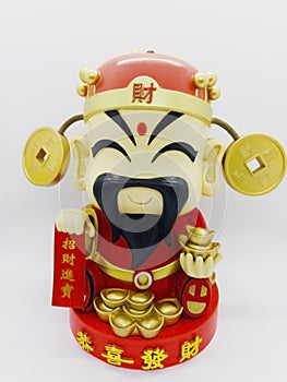 God of prosperity doll or Deity figurine holding a message `Pros