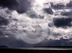 God Rays, Storm Clouds that resemble a face (top right) photo