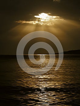 God's rays and a boat on the sea