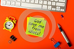 God save me from idiots - message on office workplace