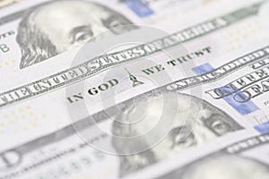 In god we trust sentence on 100 dollar banknote close up view. In God We Trust from the 100 dollar bill