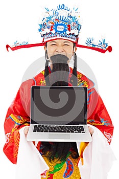 God of wealth holding a laptop