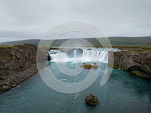 Godafoss waterfall in Iceland and its incredible surroundings, aerial view photo