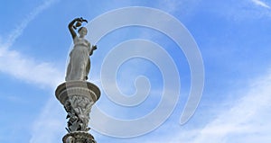 Goddess Hebe statue and blue sky background photo