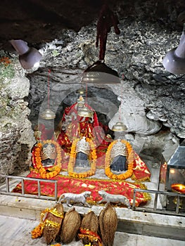goddess idol as vaishno devi in the cave at tapkeshwar mahadev dehradun uttarakhand India photo