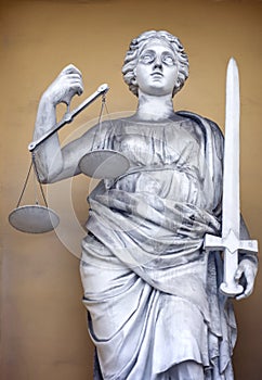 Goddess of justice with sword and scales in her hands