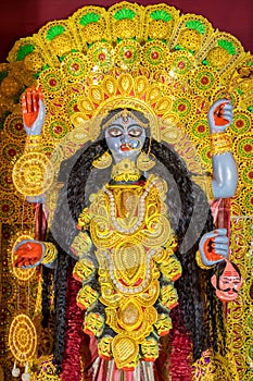 Idol of Goddess Maa Kali at a decorated puja pandal in Kolkata, India