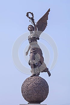 Goddess of victory Nike on sphere.