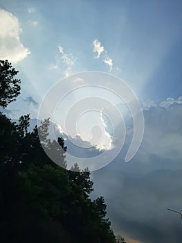 Godly light on blue sky photo