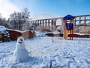 Goeltzschtalbruecke with white wintry snowman