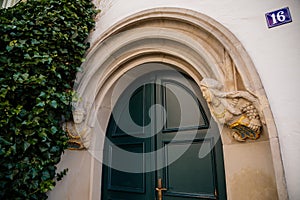 Goerlitz, Saxony, Germany, 04 September 2021: antique renaissance portal, floral ornaments, entrance to house at sunny summer day