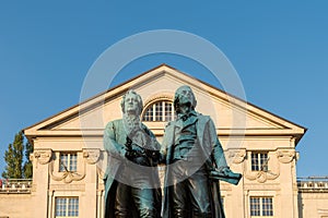 Goethe-Schiller-Denkmal in Weimar im Sonnenlicht am Morgen bei blauem Himmel photo