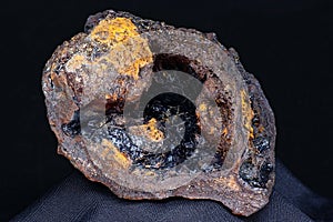 Goethite geode in limonite on a dark background