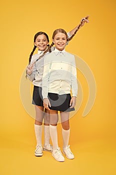 Going crazy. happy girls in school uniform. kid fashion. Friendship and sisterhood. education concept. back to school