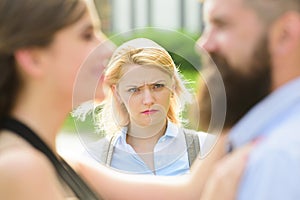 Going into a jealous rage. Jealous woman look at couple in love on street. Unhappy girl feeling jealous. Bearded man