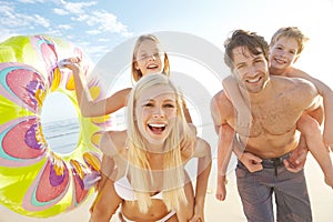 This is going to be an amazing day. a happy young family at the beach.