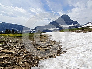 Going to the Sun Road, View of Landscape, snow fields In Glacier National Park around Logan Pass, Hidden Lake, Highline Trail, whi