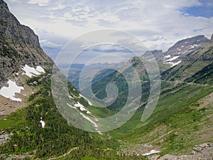 Going to the Sun Road, View of Landscape, snow fields In Glacier National Park around Logan Pass, Hidden Lake, Highline Trail, whi