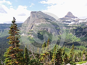 Going to the Sun Road, View of Landscape, snow fields In Glacier National Park around Logan Pass, Hidden Lake, Highline Trail, whi