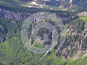 Going to the Sun Road, View of Landscape, snow fields In Glacier National Park around Logan Pass, Hidden Lake, Highline Trail, whi