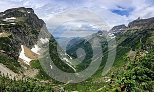 Going to the Sun Road, View of Landscape, snow fields In Glacier National Park around Logan Pass, Hidden Lake, Highline Trail, whi