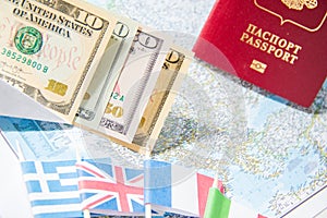 Going to travel. Passport, money, flags of Greece, UK, Italy, France on map. Save money on travel, planning for budget concept.