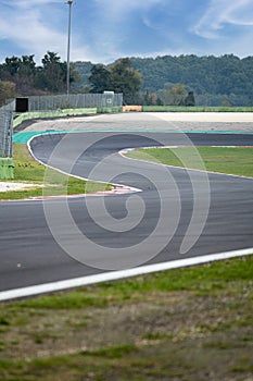 Going towards double turn motorsport circuit asphalt track