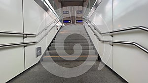 going through train station underpass and ascending stairs