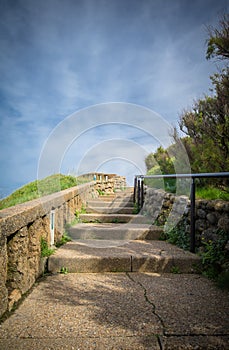 Going upstairs with copy space in scenic beautiful coastal park in blue sky, biarritz, basque country, france