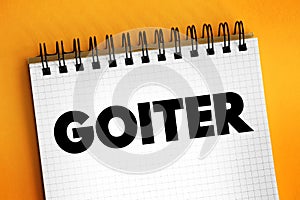 Goiter is a lump or swelling at the front of the neck caused by a swollen thyroid, text concept for presentations and reports