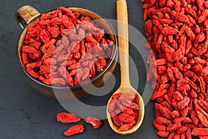 Goji berries over slate plate. Healthy food concept