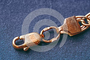 Gold 585 stamp. Gold clasp of a golden bracelet with hallmark 585.