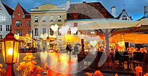 Gold Autumn Tallinn  rainy evening city holiday  light blurring  Street cafe  bokeh g city light evening restaurant table cup of c