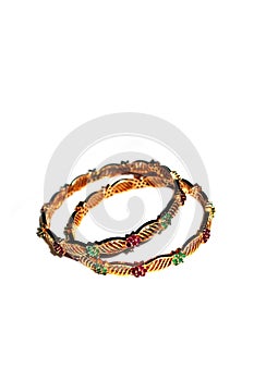 Gold bangles with green and pink rubies