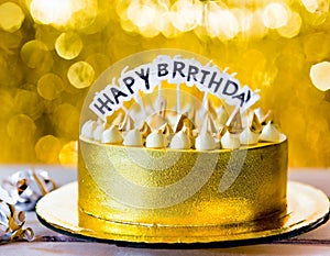 A gold banner with a happy birthday message decorates the birthday cake