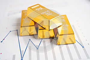 Gold bar on graph, economy finance exchange trade investment concept