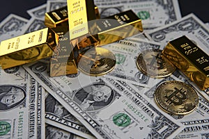 Gold bars and american one dollar bills. Scattered bitcoin digital cryptocurrency coin.