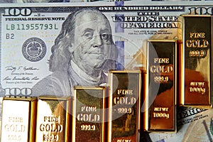 Gold bars arranged as a graph exponential on bank note .