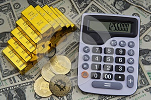 Gold bars with calculator on dollar bills background and bitcoin digital cryptocurrency coin.