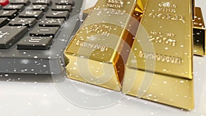 Gold bars with calculator and snowflakes effect